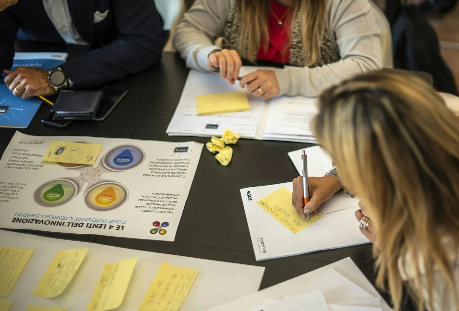 Colleagues working through papers at a table